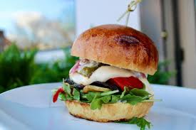 Hootch and Banter signature dishes Every Day I'm Brussel'nThe “Kidd” Prime BurgerHere, Fishy Fishy!